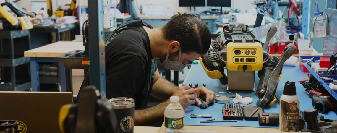 Boston Dynamics engineer working on the Spot robot